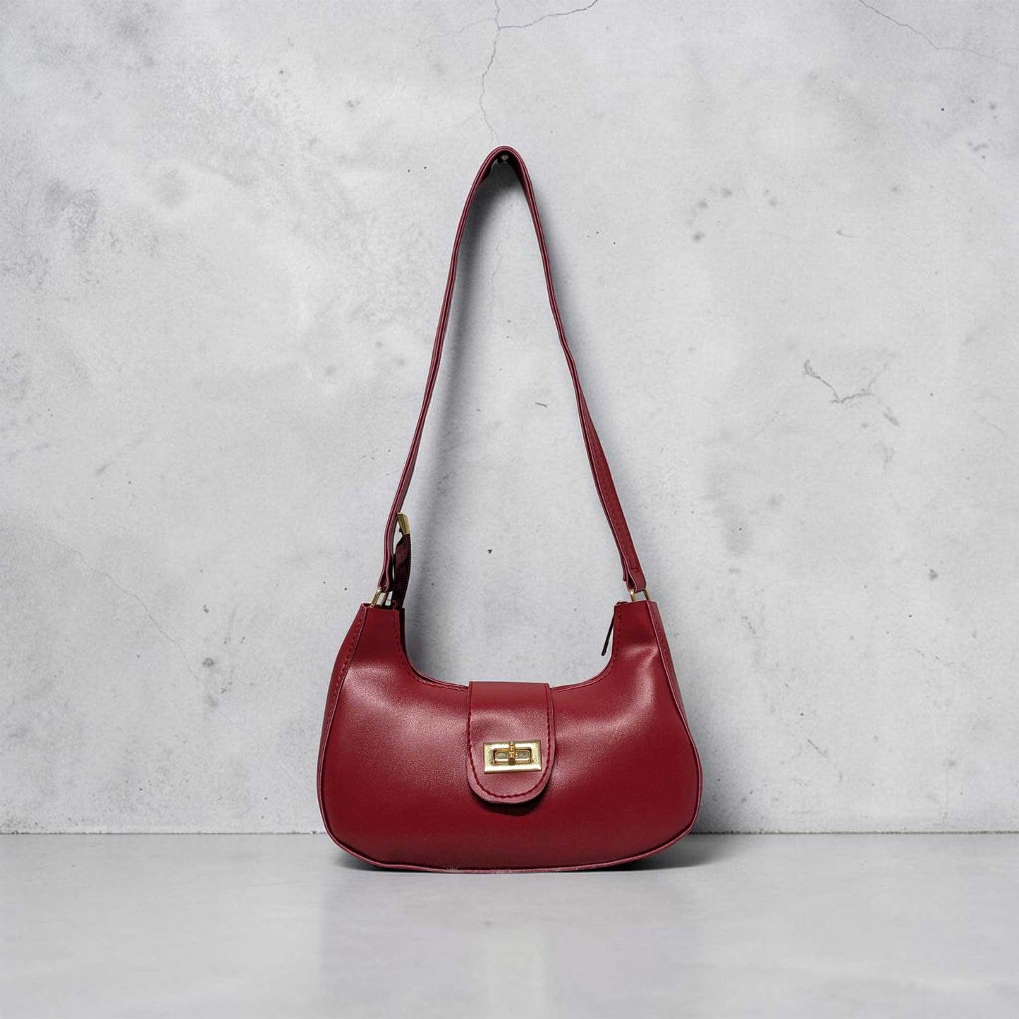 Red handbag on a light gray background
