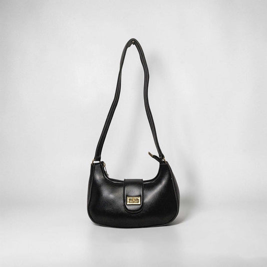 Black handbag on a light gray background