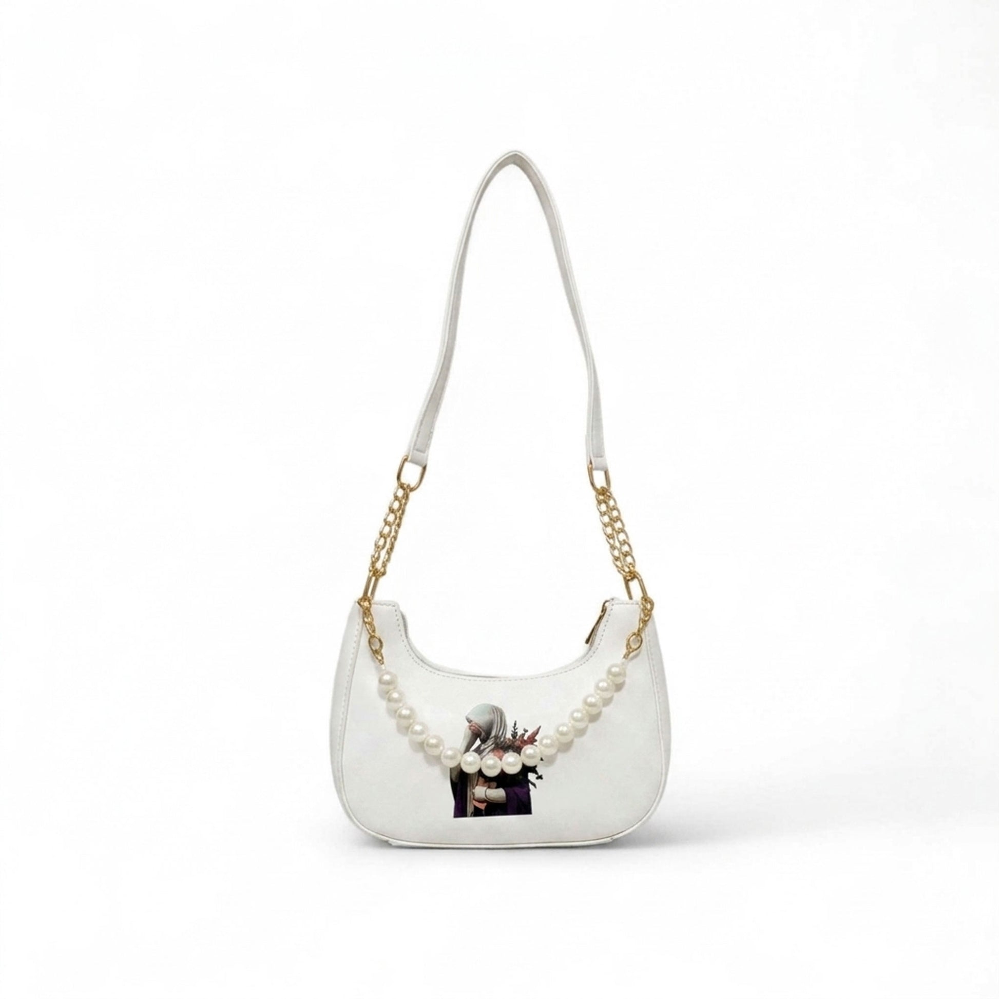 White handbag with gold chain and floral design on a white background