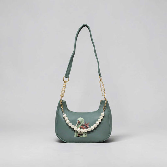 Green handbag with pearl chain on a light gray background