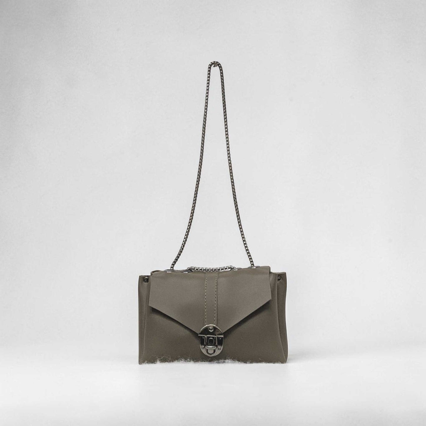 Gray handbag with a chain strap on a light gray background