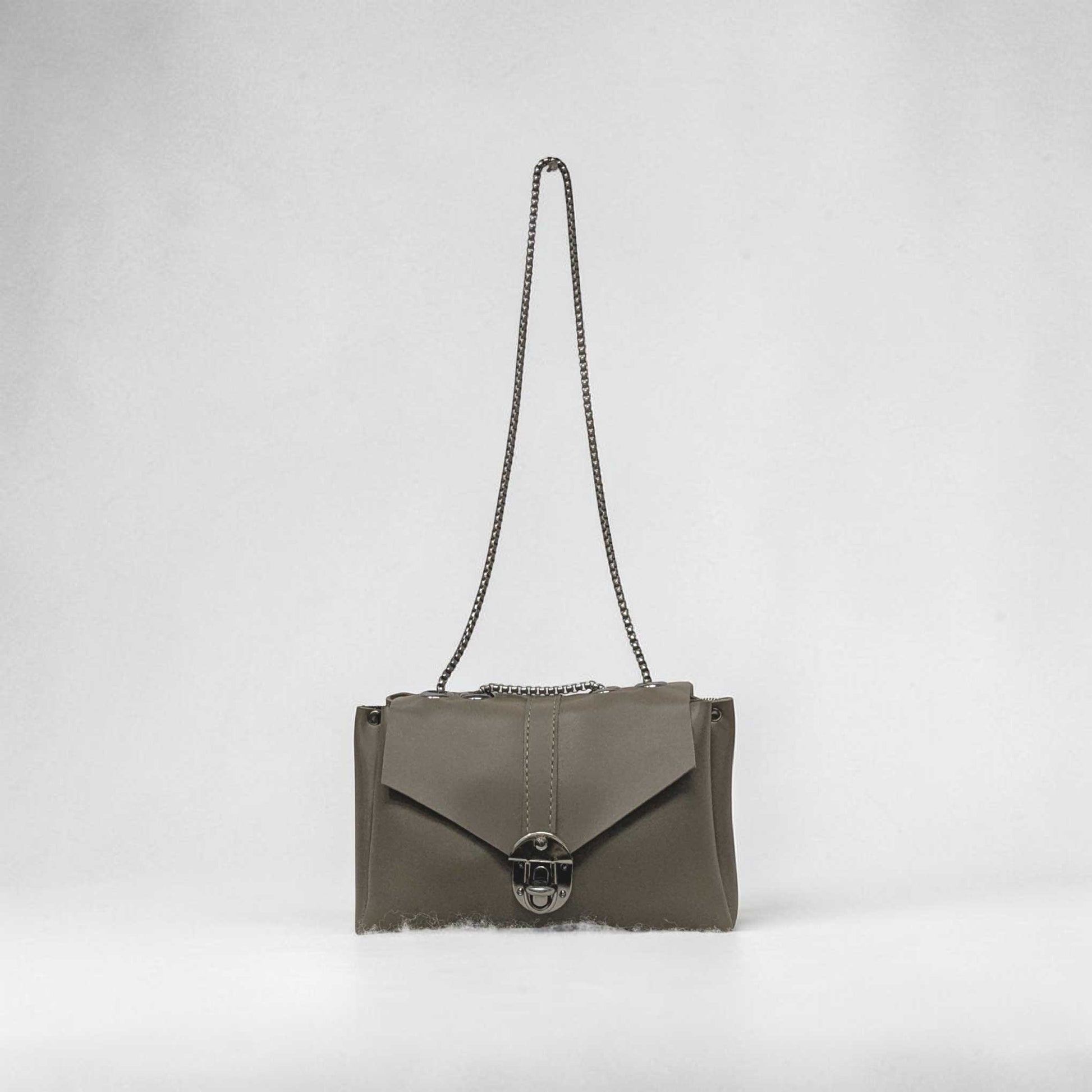 Gray handbag with a chain strap on a light gray background