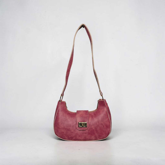 Pink handbag with a strap on a light gray background
